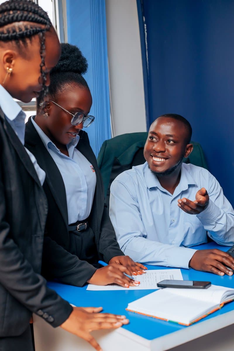 A Divine Credit Group loan officer consulting with clients