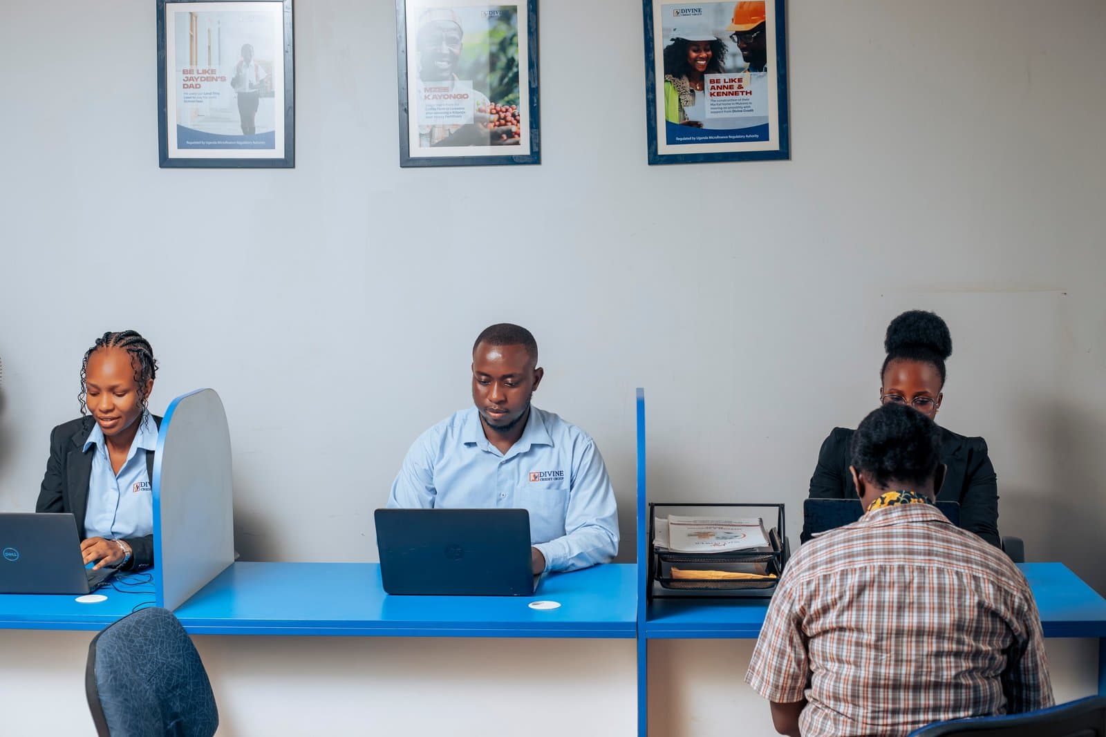 Divine Credit Group staff assisting a client